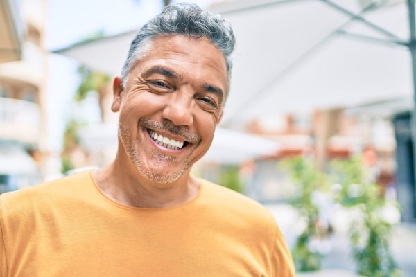 a man is happy following his oral cancer screening